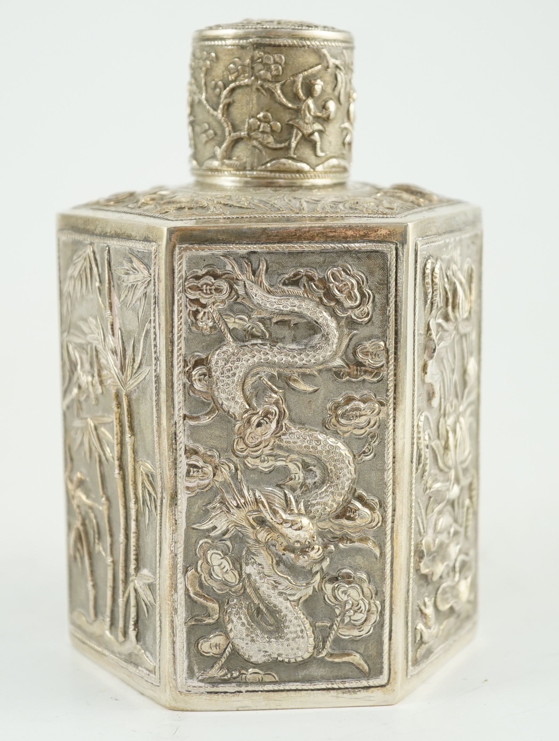 A late 19th century Chinese Export silver hexagonal tea caddy and cover, by Cumwo